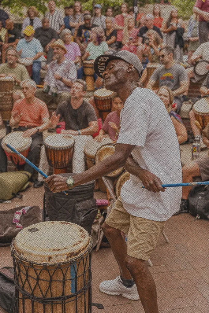 a man drumming at Pritchard Park