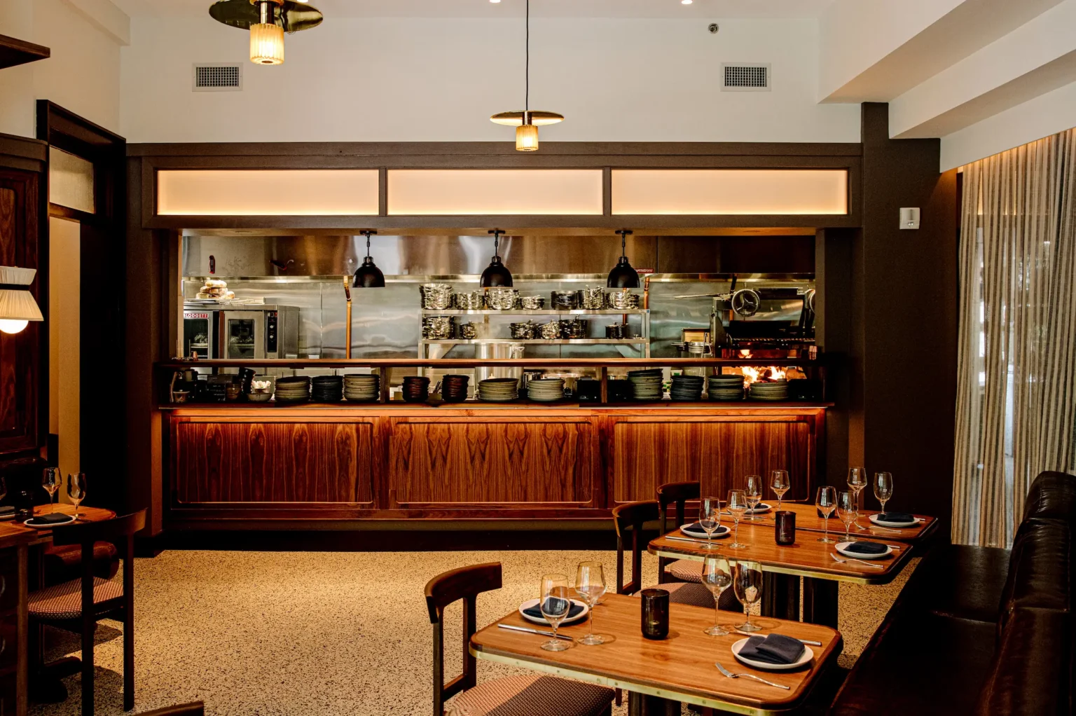 tables in Luminosa with a view of the open grill line