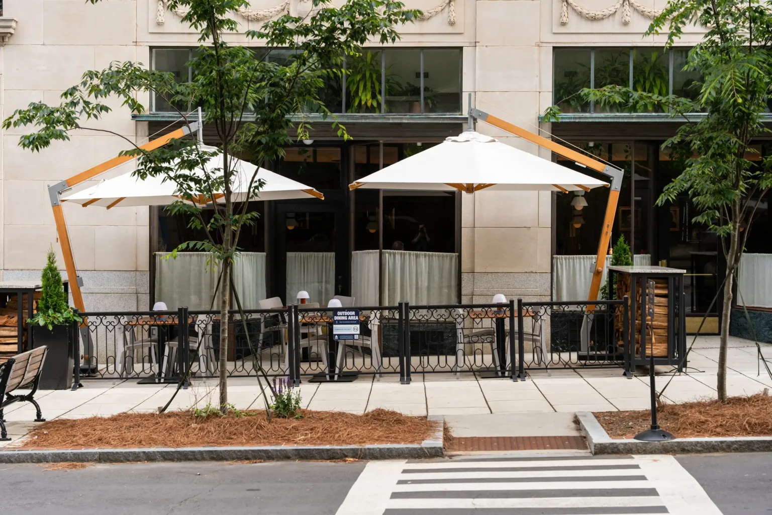 covered patio tables at Luminosa