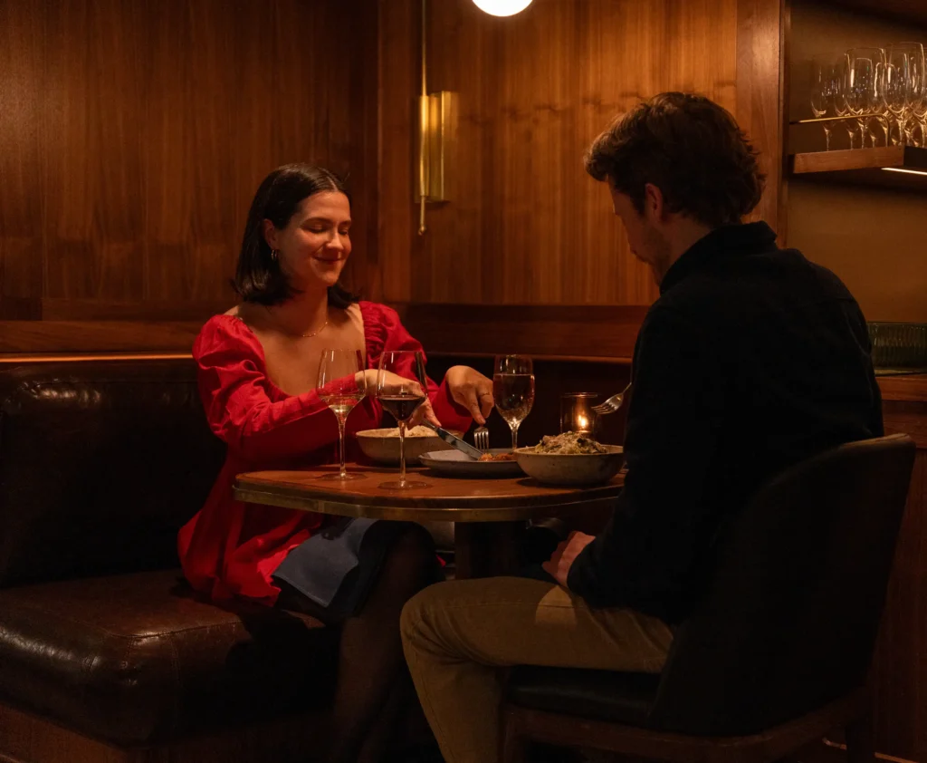 a couple having dinner at luminosa in the flat iron hotel