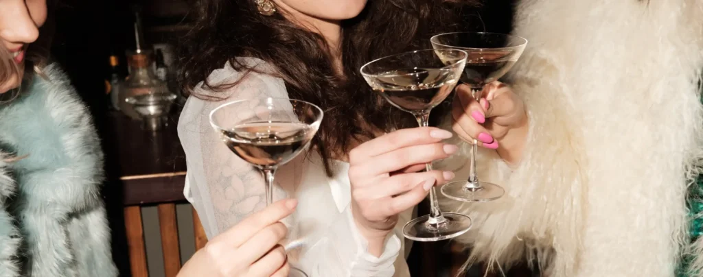 women toast with champagne glasses