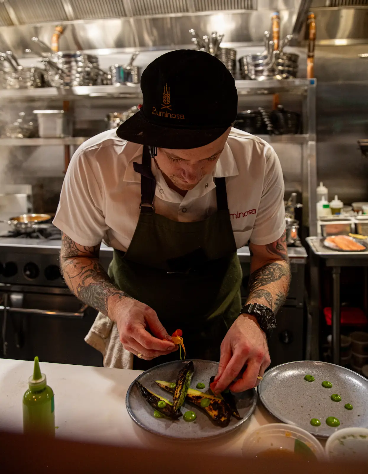 the chef preparing a masterpiece at luminosa in the flat iron hotel