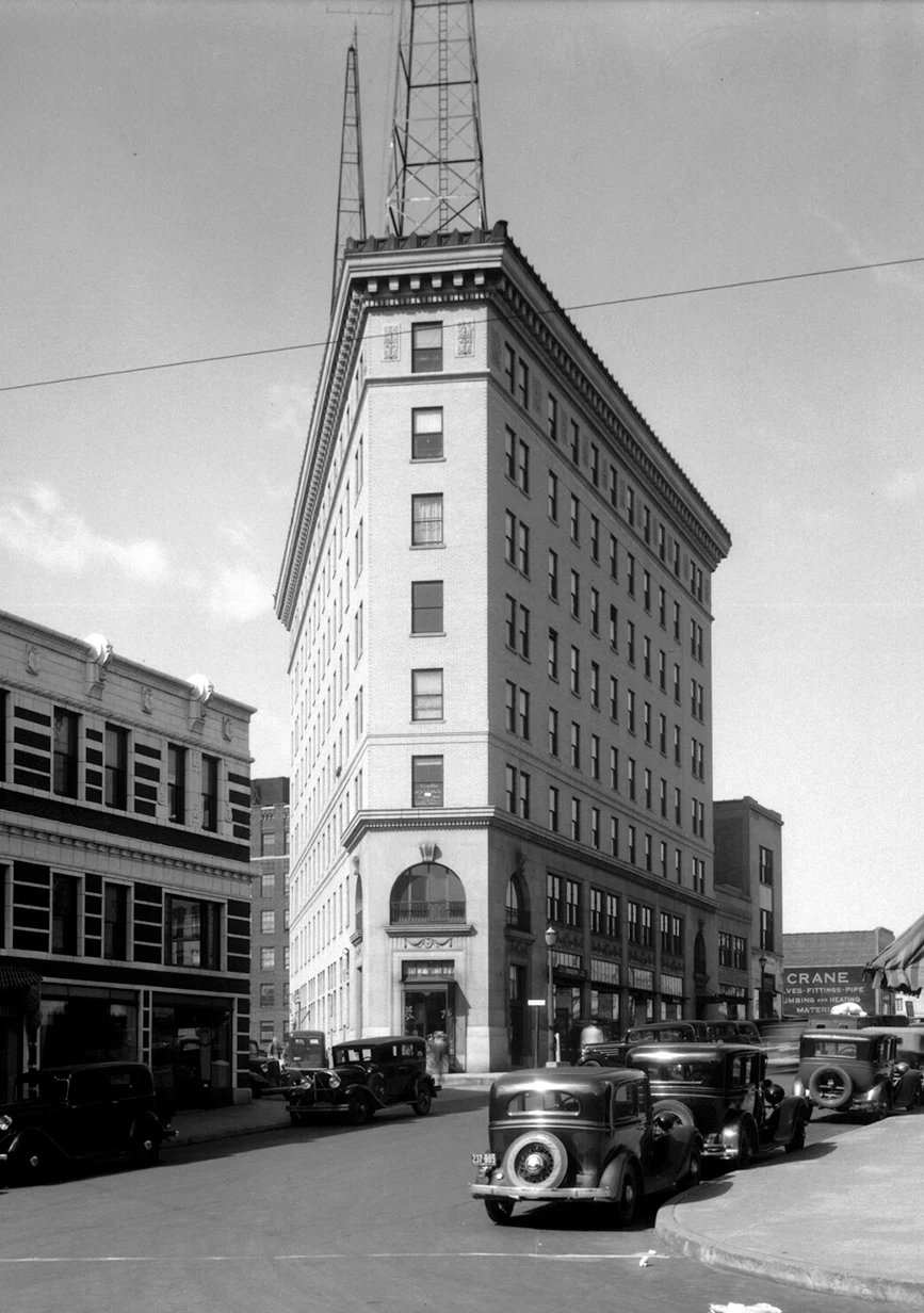 a historic photograph of the Asheville Flat Iron Building