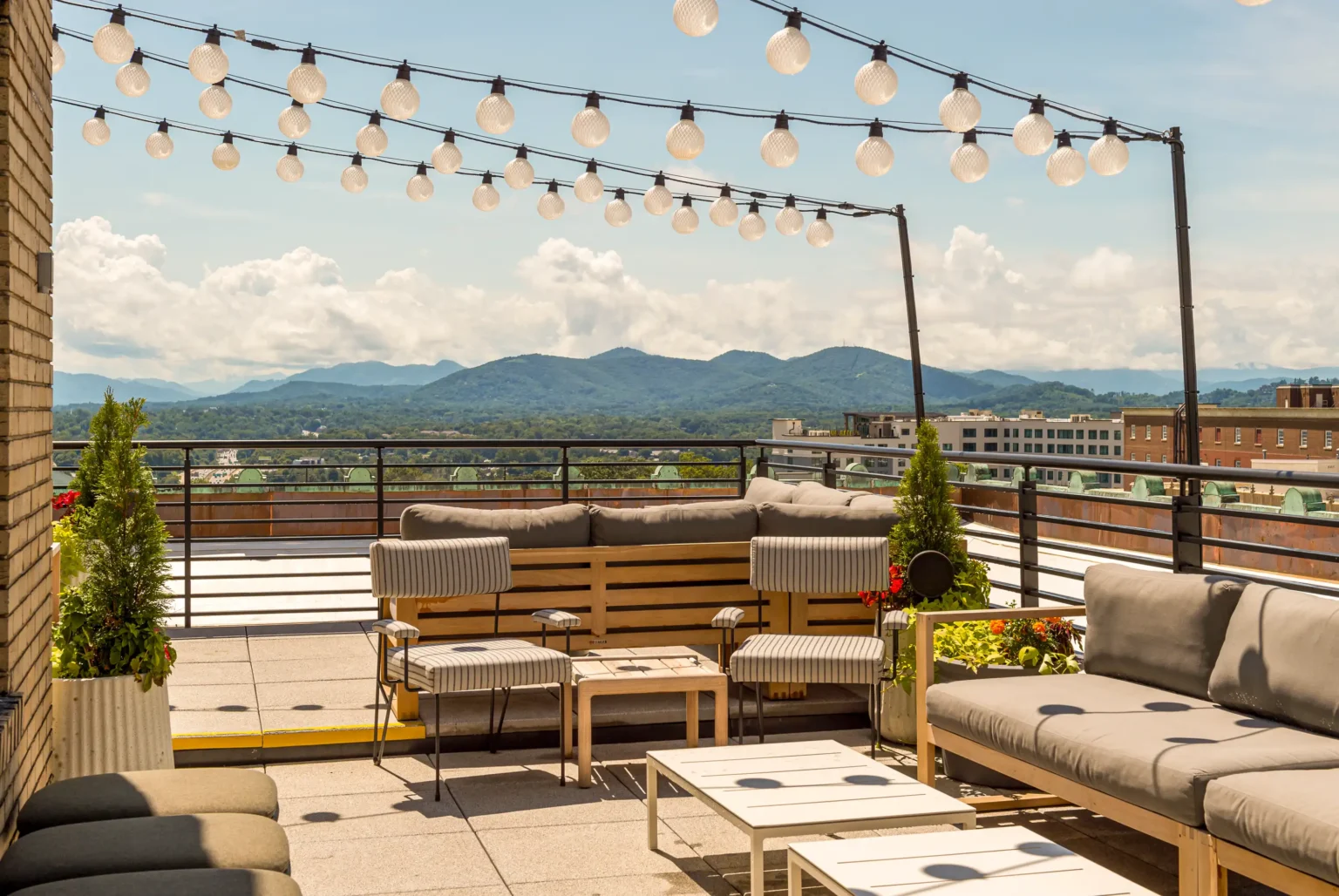 the grand first patio of the flat iron hotel's rooftop bar