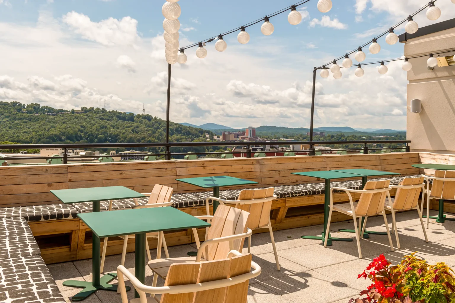 the cozy second patio of the flat iron hotel's rooftop bar