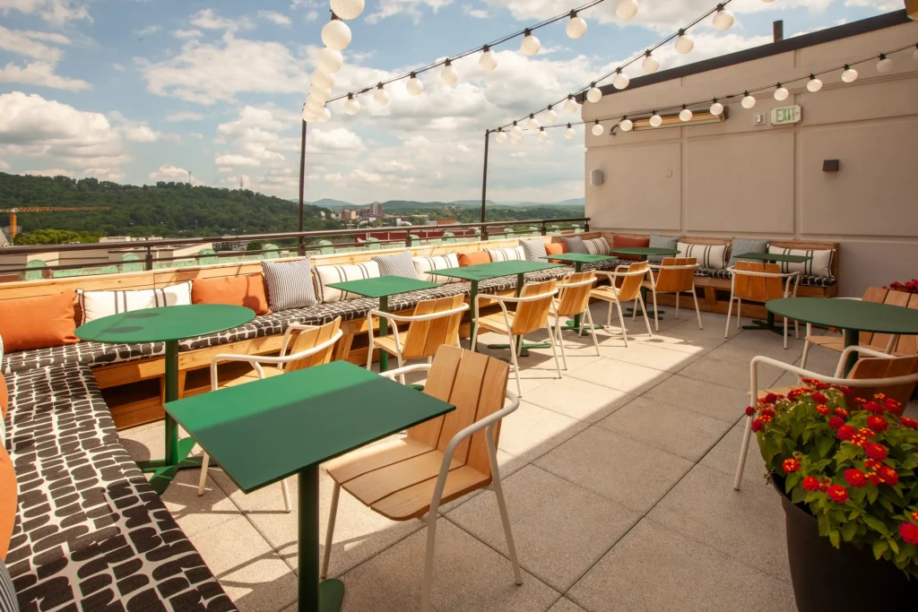 the cozy second patio of the flat iron hotel's rooftop bar