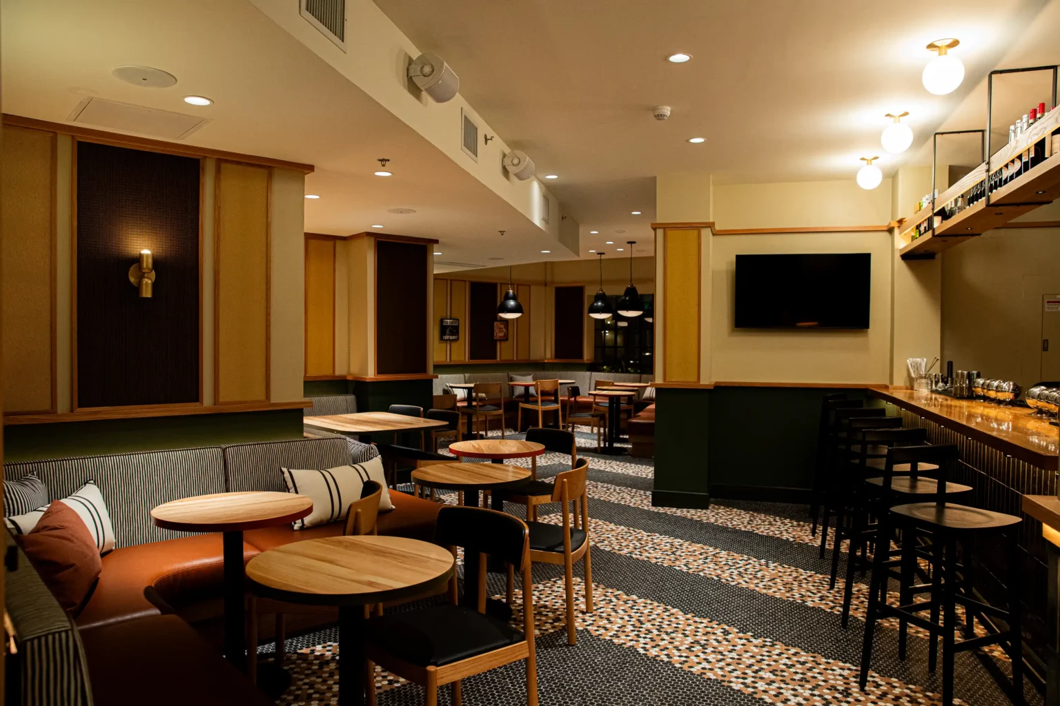 the interior of the flat iron rooftop bar at night