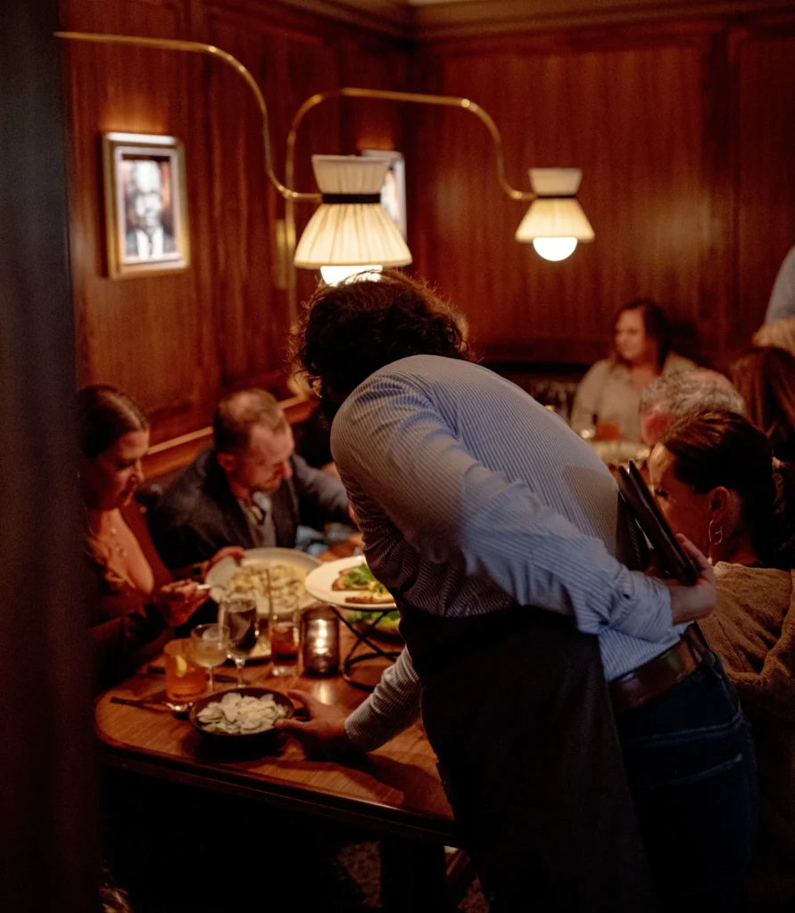 server at luminosa, in the flat iron hotel