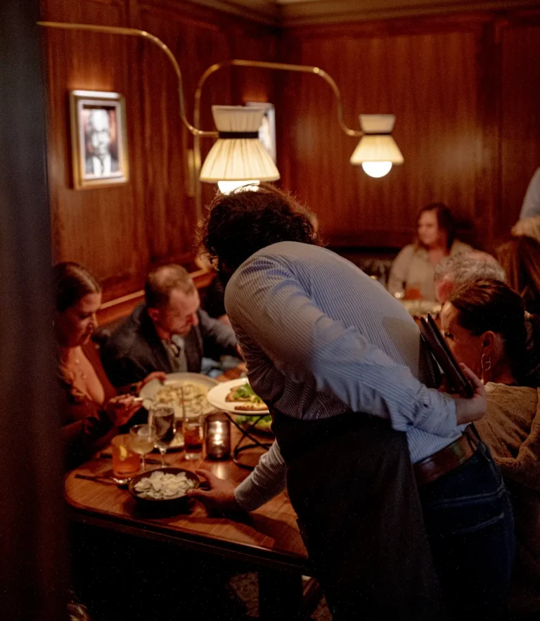 server at luminosa, in the flat iron hotel