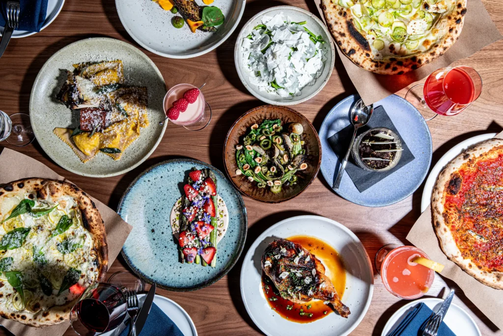 variety of dishes from luminosa at the flat iron hotel