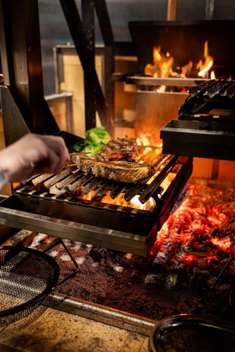 steak bing cooked in a wood fire oven at the Luminosa in the Flat iron hotel