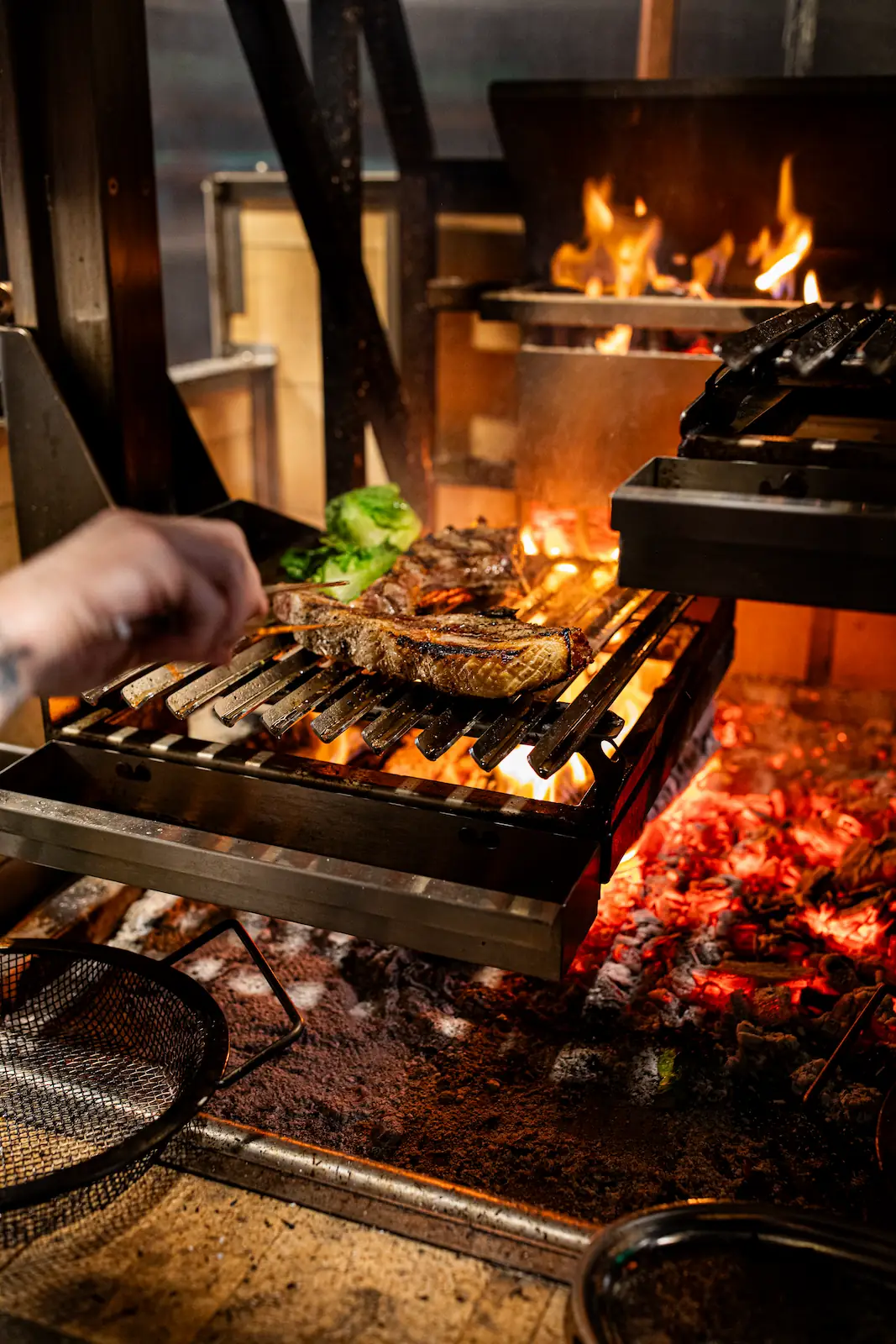 steak bing cooked in a wood fire oven at the Luminosa in the Flat iron hotel