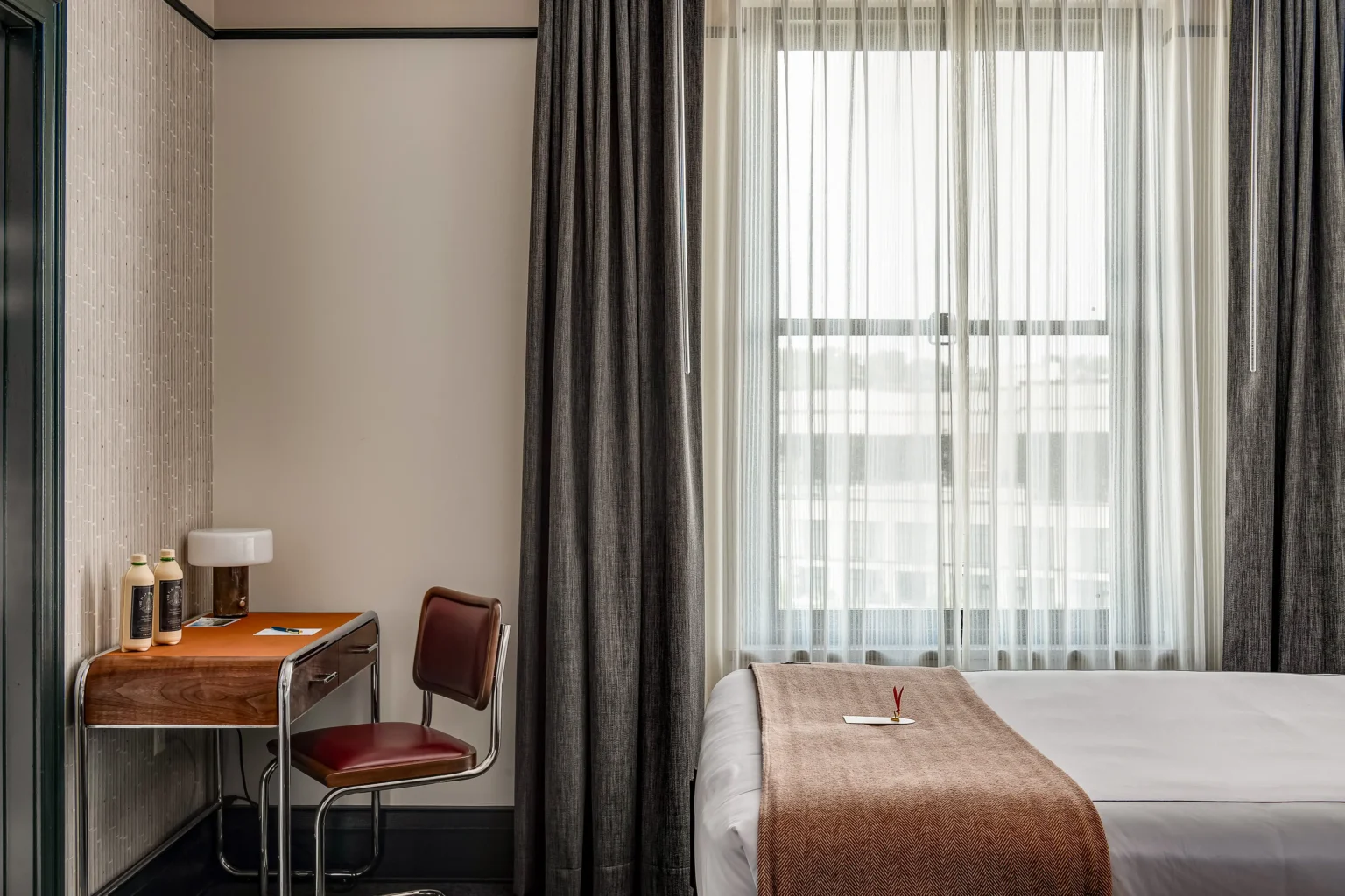 desk area in a double queen room at the flat iron hotel