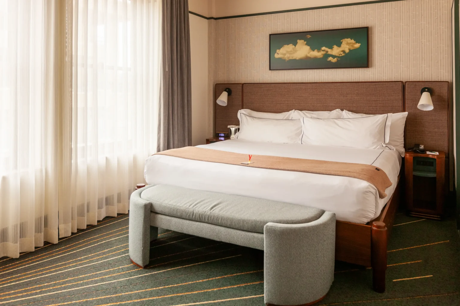 Premier King Suite at the flat iron hotel , showing the bed and art work