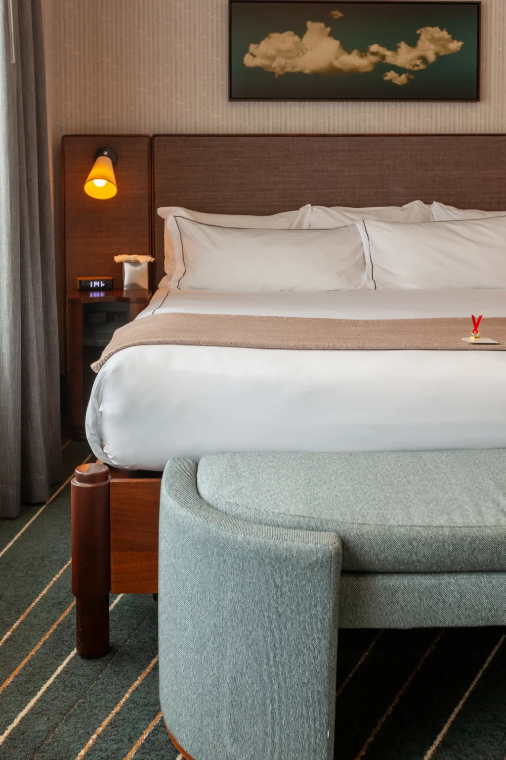 Premier King Suite at the flat iron hotel showing the bed and art work