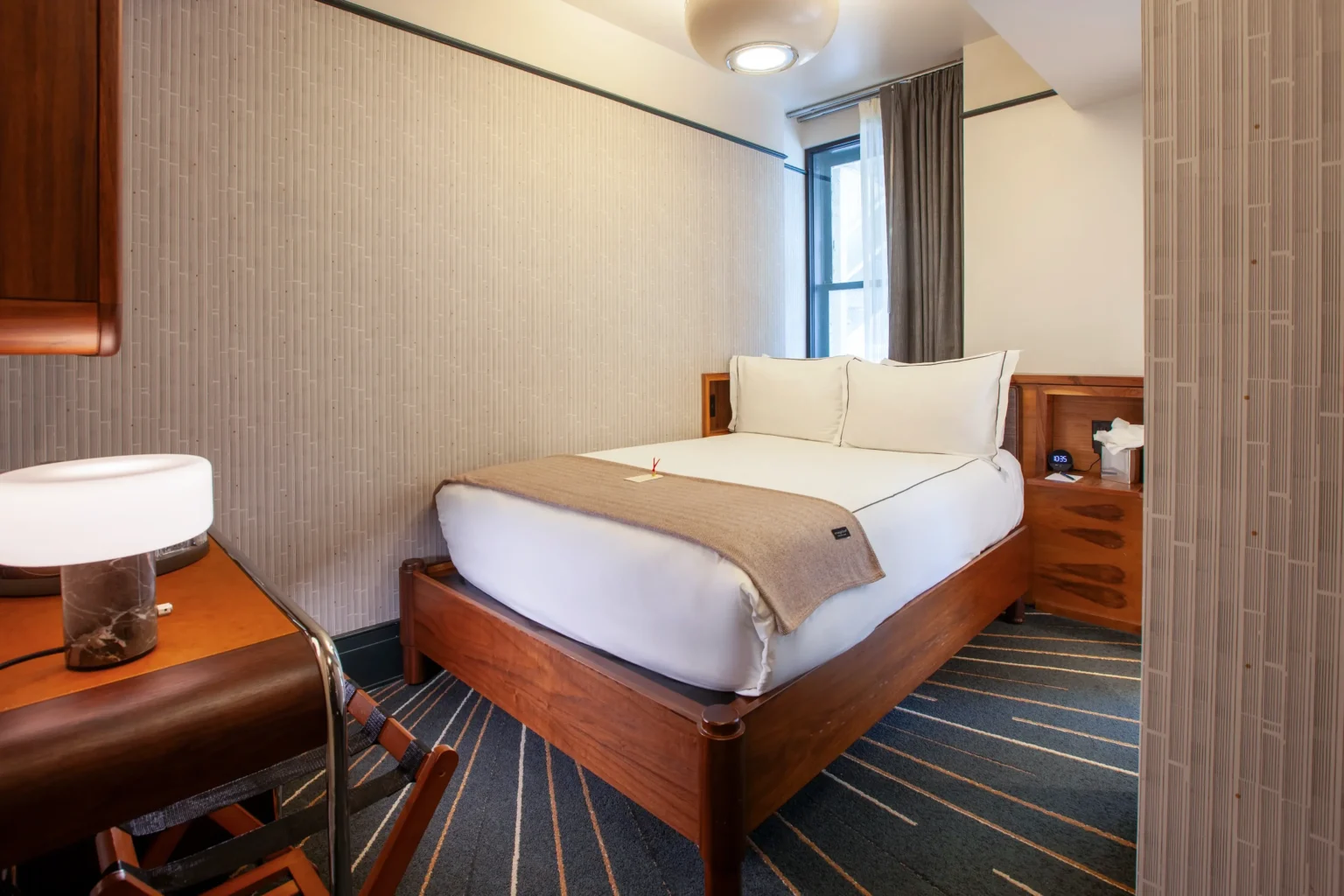 bed and furnishings in the nook room at the flat iron hotel