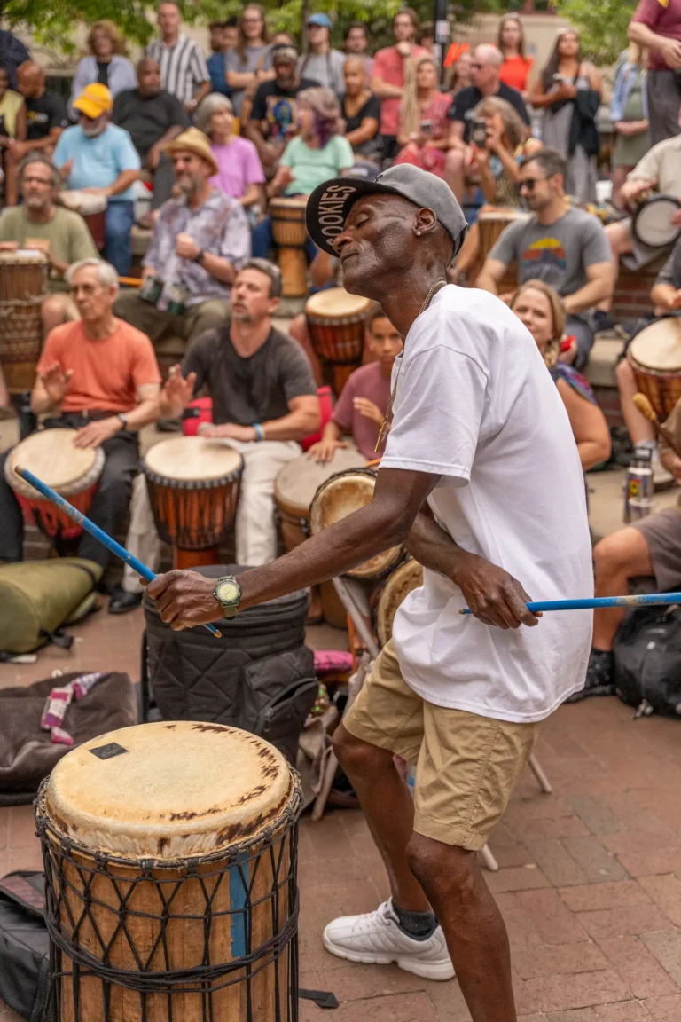 a man plays drums at pritchard park