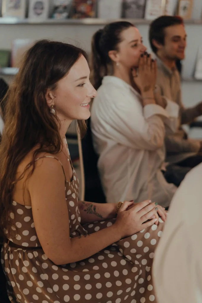 a woman and her coworkers celebrate at a team retreat