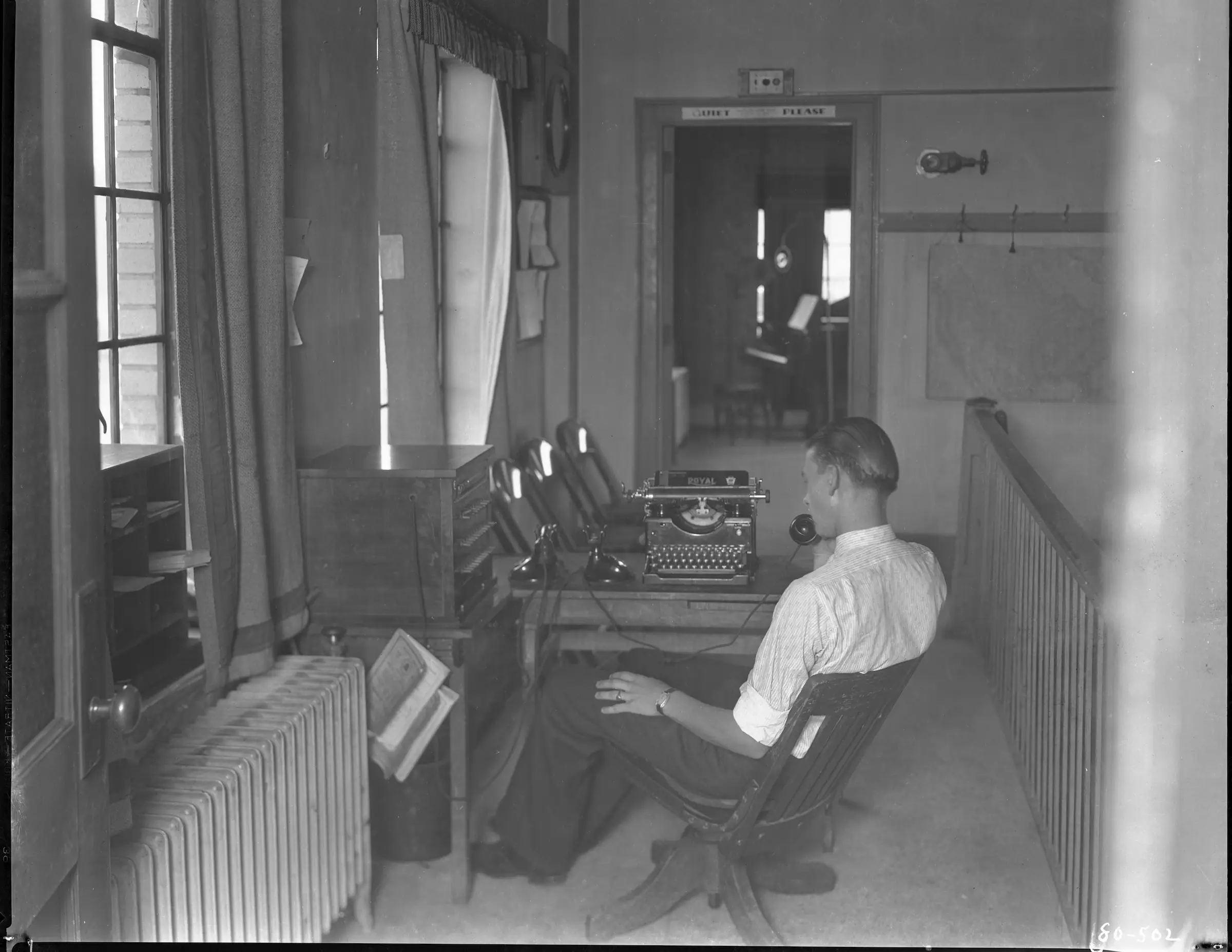 radio station employee on a call in the 1920's