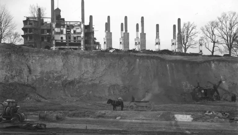 Battery Park Hill being dug out, with the demolished hotel on top