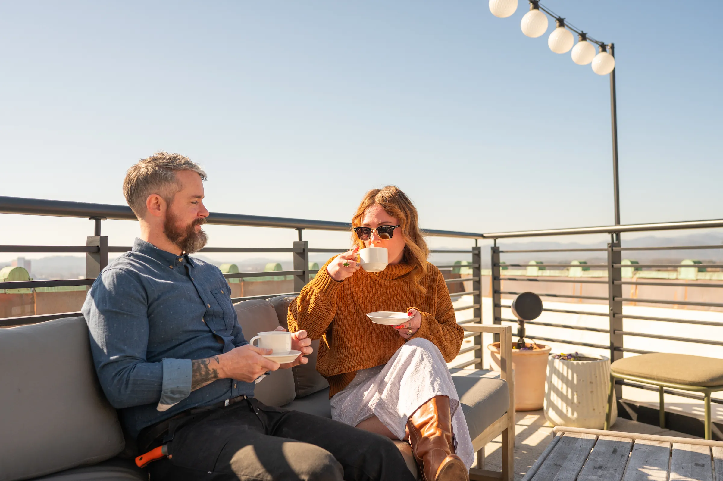 A couple sipping coffee at the Rooftop Caffe