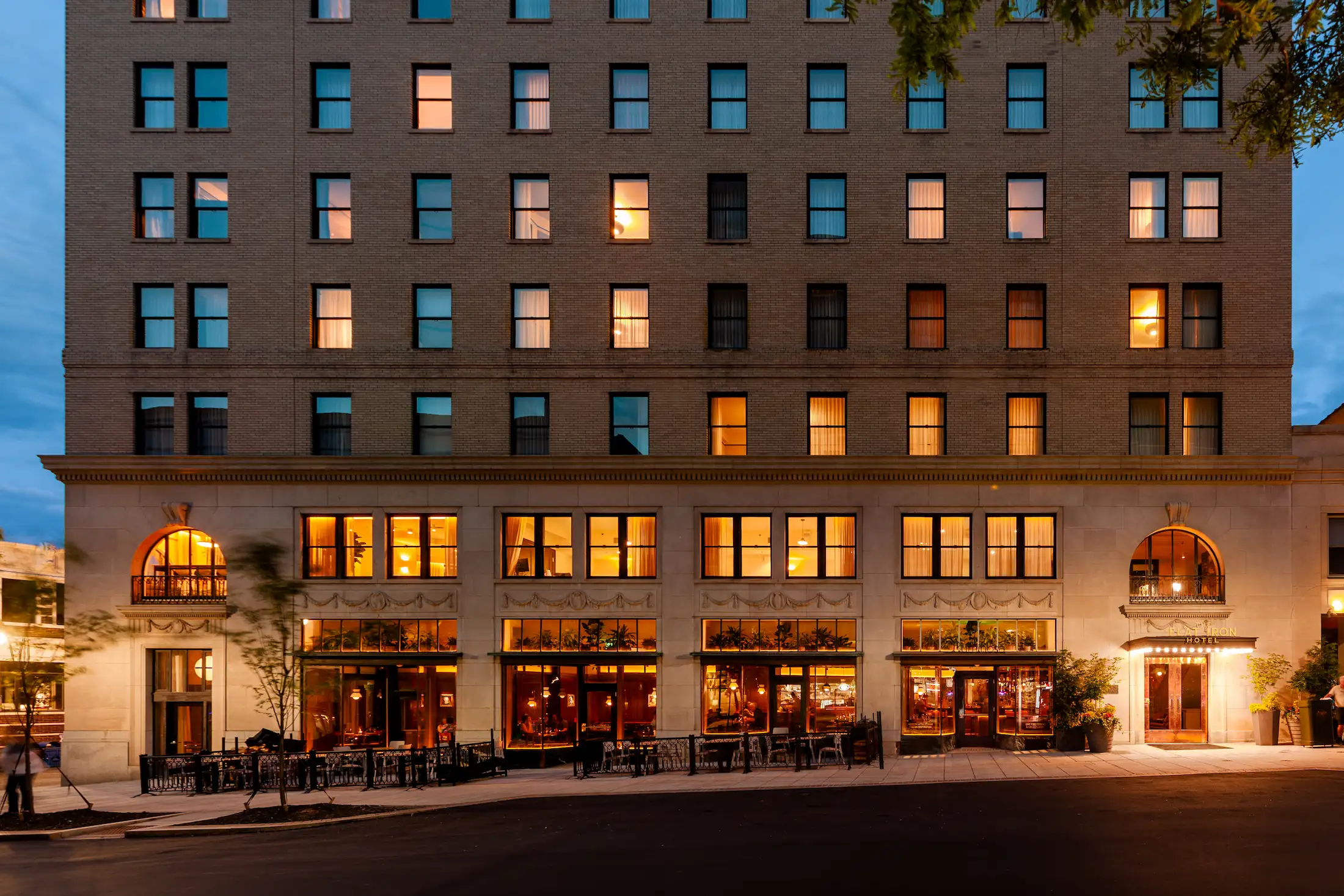 The facade of the Flat Iron Hotel in Asheville at night