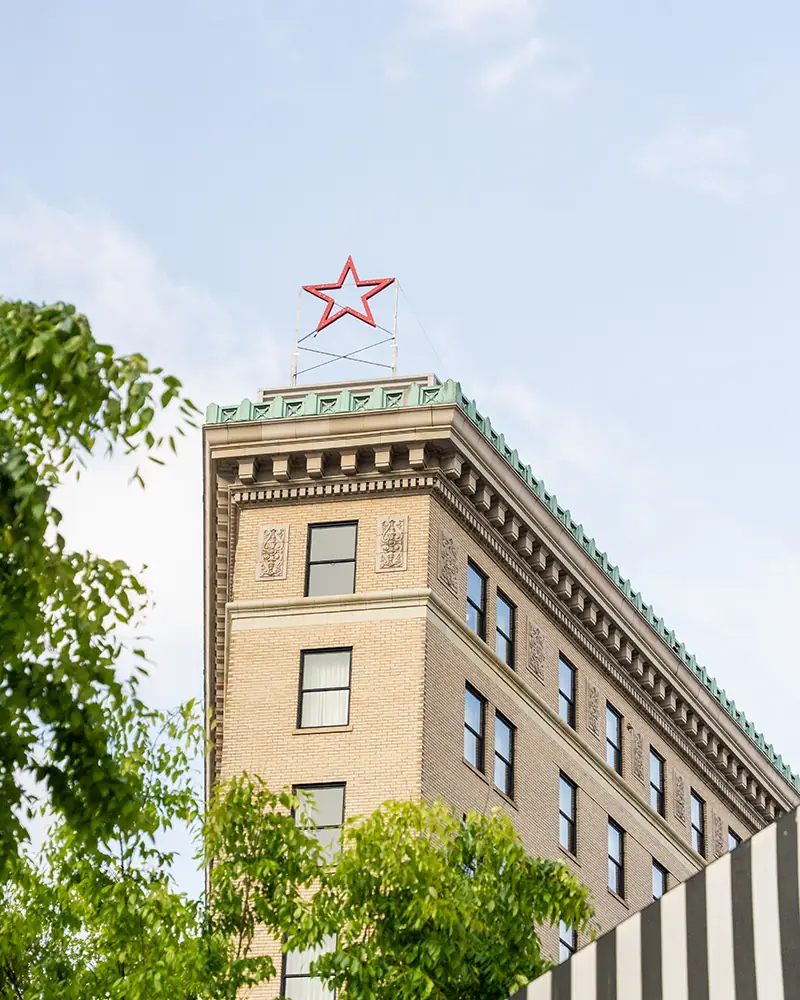 the apex of the Flat Iron Hotel as seen from the street